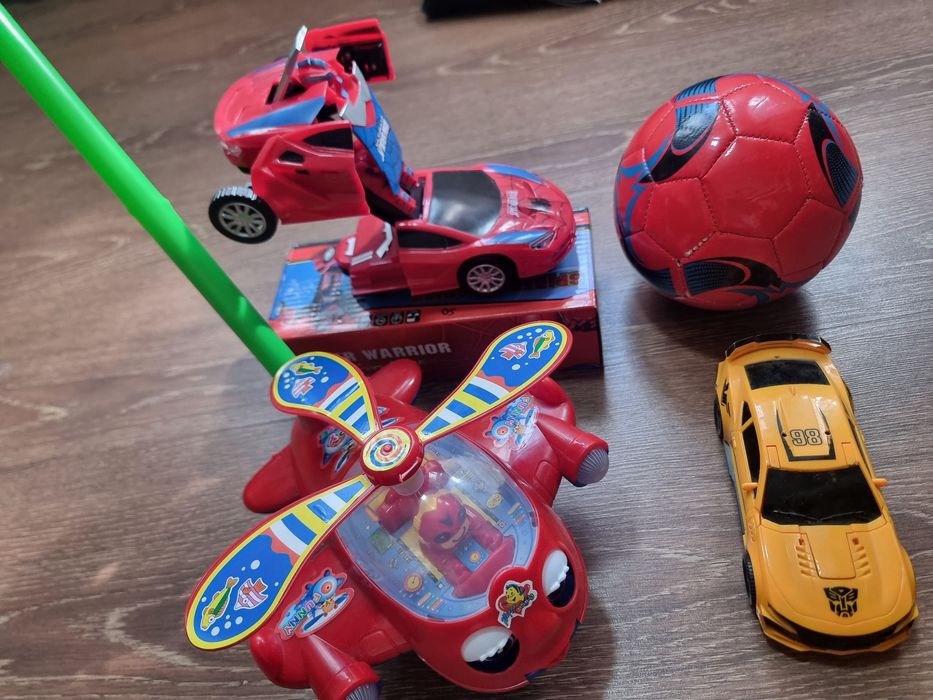 Цена за все Игрушки 2 шт трансформер светомузикалний работает Каталка