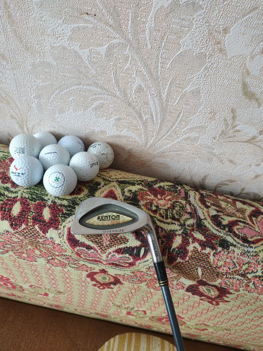 Клюшка для гольфа.