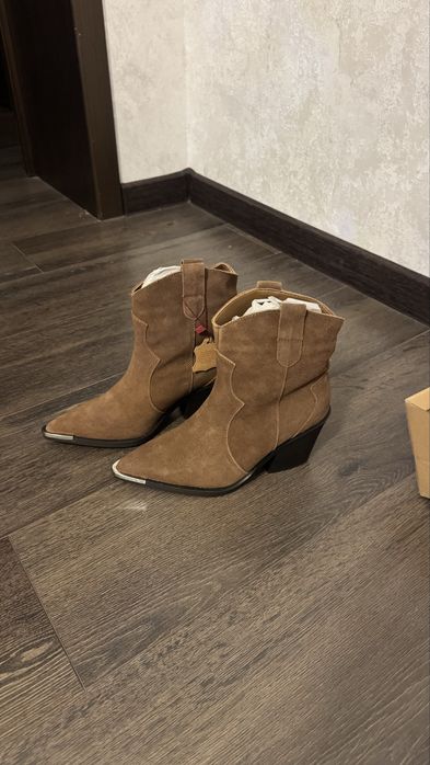 Продам новые сапоги