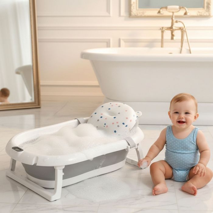 Сгъваема бебешка вана с термометър и възглавница.