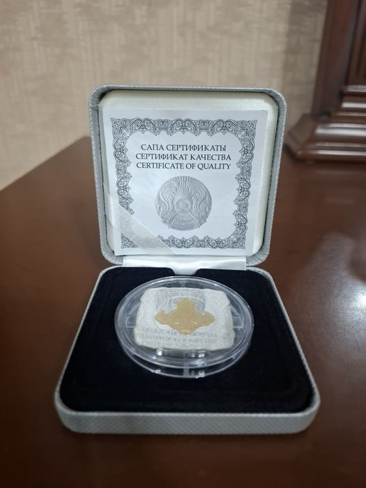 Серебрянная монета с золотом