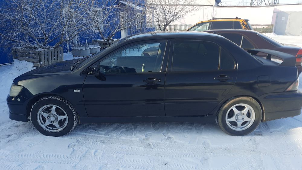 митсубиси лансер 2002