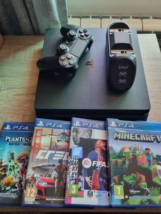 PS4 Slim 500GB + 2 manete + 4 jocuri + stand Foarte bună
