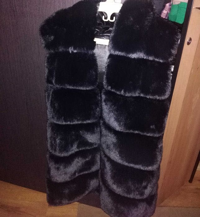 Vesta blana artificială