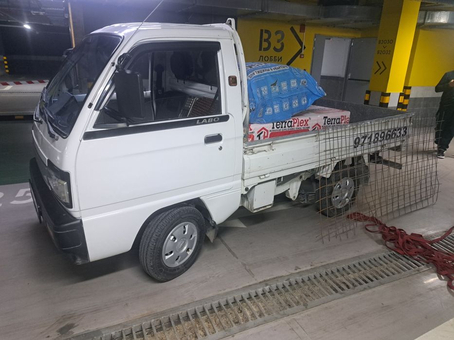 Вывоз мусир мусир хизмати хохлаган машена бор Исузи. Шенера ва Лабо