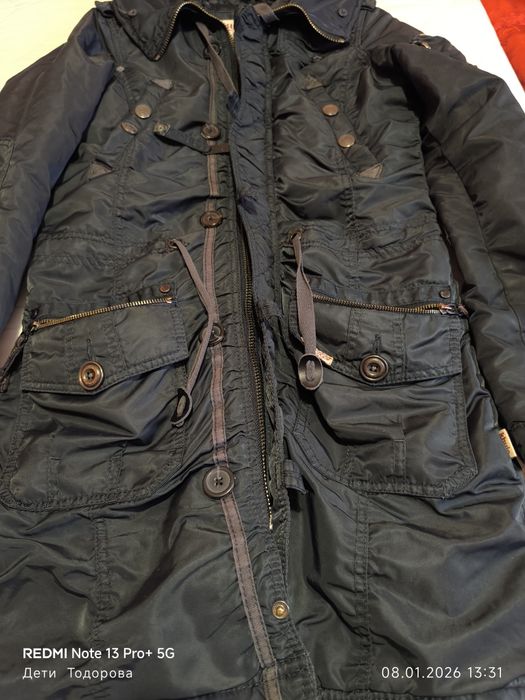 Продавам тъмно синьо,зимно яке KHUJO.