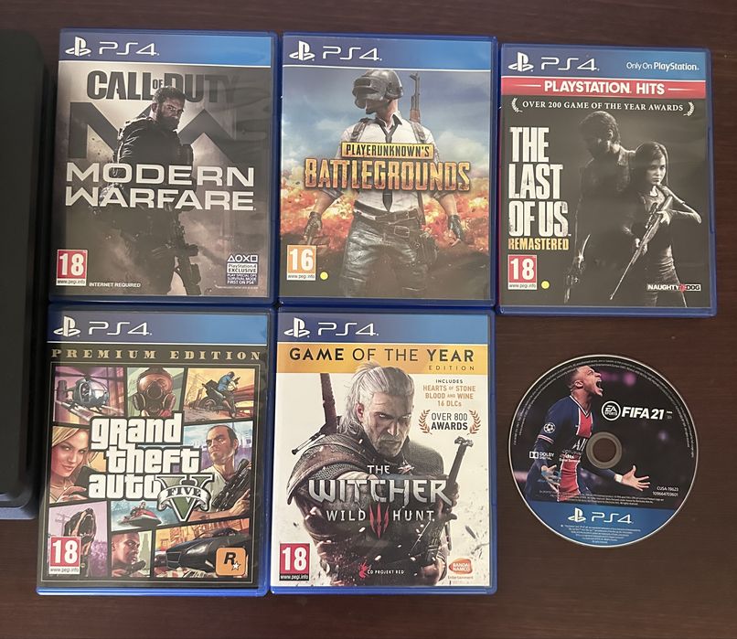 PS4 Slim 500GB + 2 manete + 6 jocuri de top