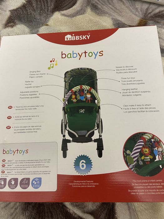 Дуга на коляску с игрушками