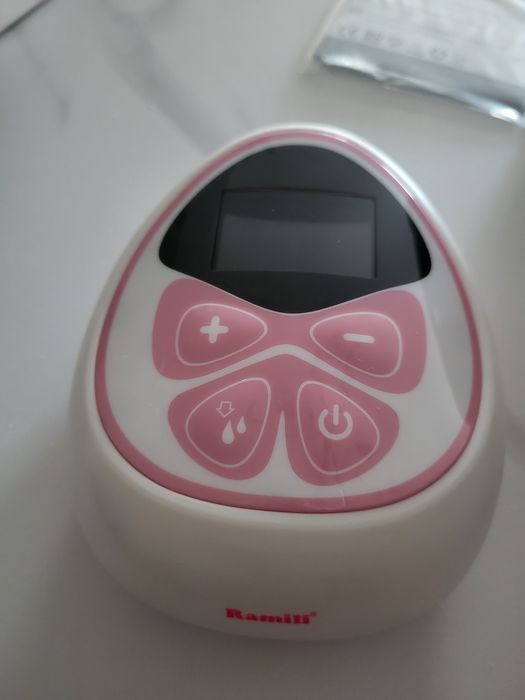 Электрический молокоотсос  Ramili