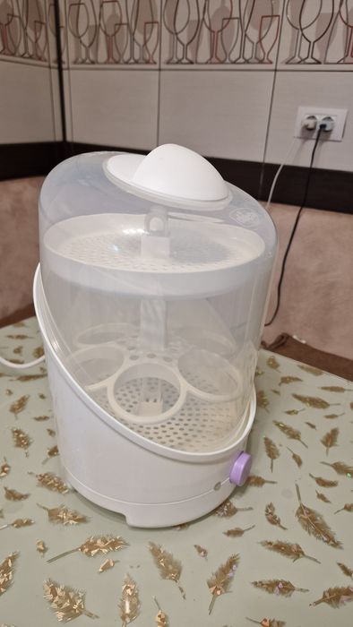Vand Sterilizator biberoane/suzete,marca Chicco
