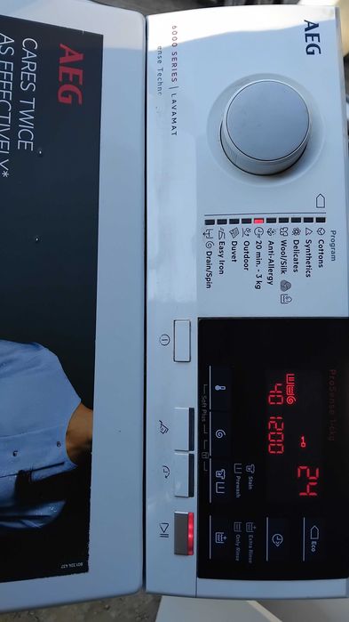 Пералня AEG с горно зареждане