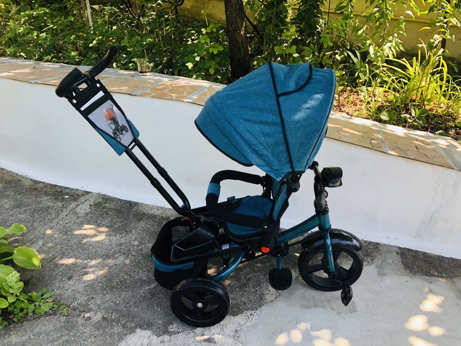 Tricicleta cu pozitie de somn si far cu melodii si jocuri de lumini