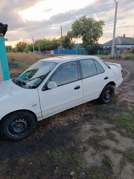 Автомобиль киа сепия