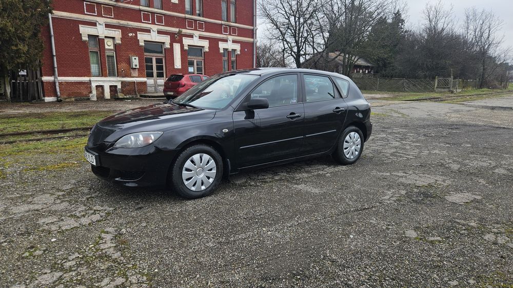 Mazda 3  an 2008 1.3 benzina