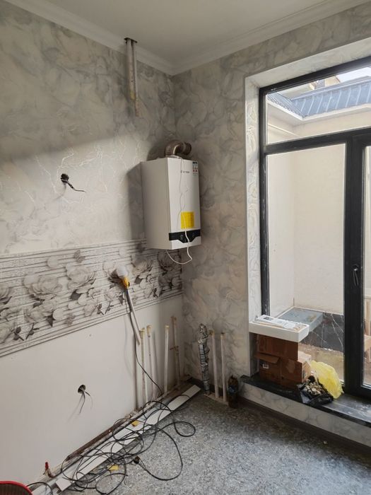 Продается трехуровневый коттедж массив Юнус Абад 15 квартал .