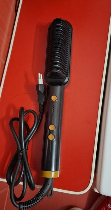 Perie termică de îndreptat părul Wavytalk 2 în 1, de culoare neagră.