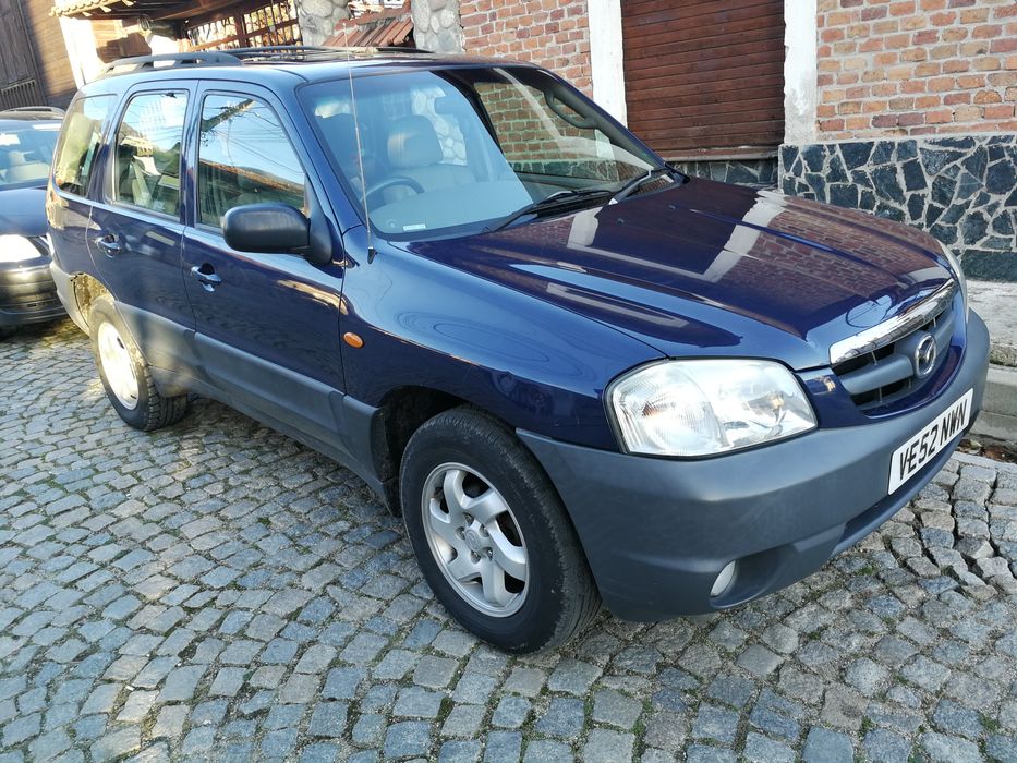 на части Mazda Tribute 2.0