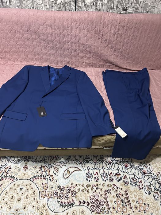 Продам новый костюм