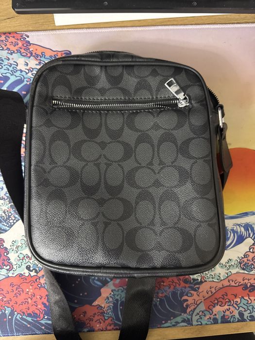 Барсетка бренда Coach