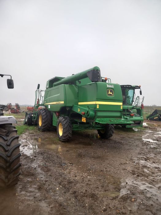 vând combina John Deere W540