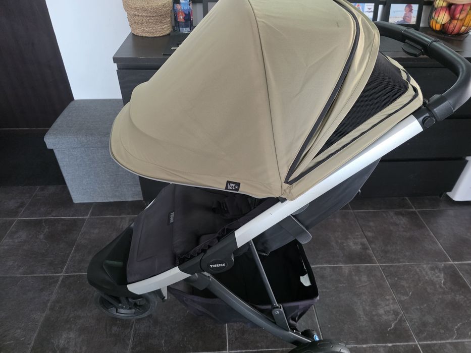 Carucior pliabil Thule Spring bej, cu suspensie, roti din spuma