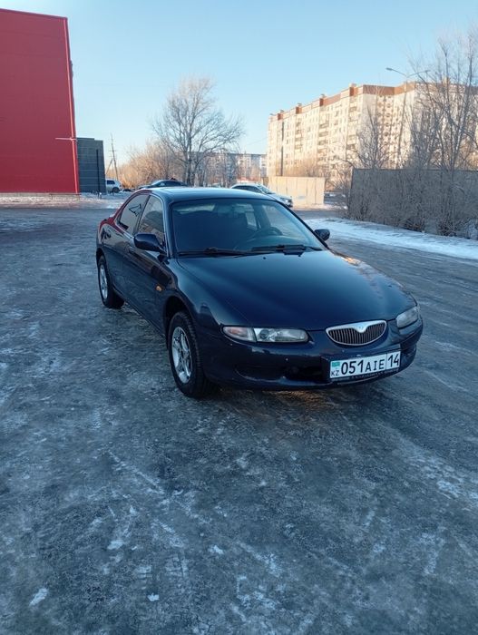 Мазда кседос 6 .