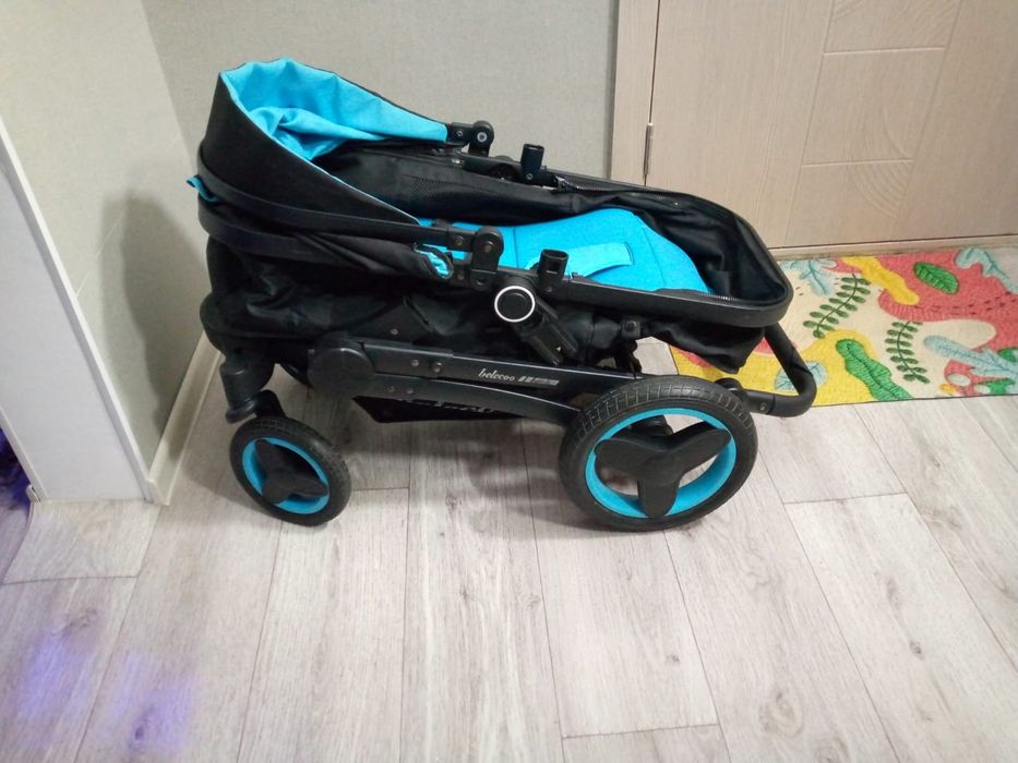 Продам коляску черно берюзовом цвете