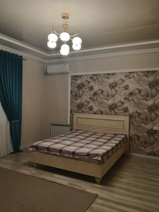 Продается двух этажный дом в махалле Мажнунтол