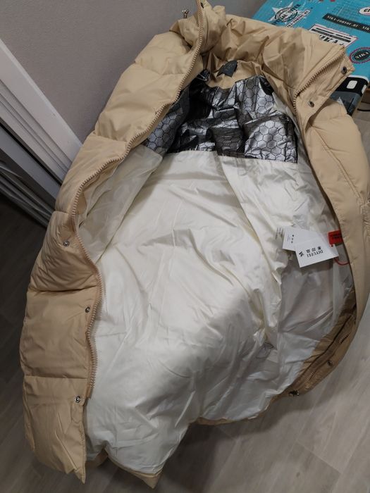 Продам пуховик длинный