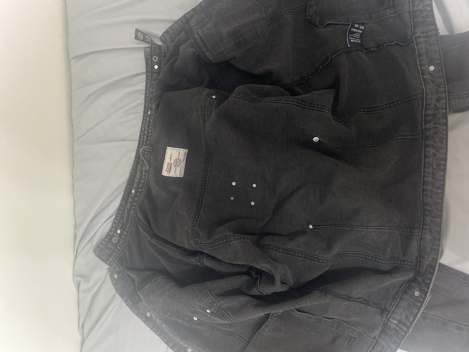 Потрёпанна джинсовка