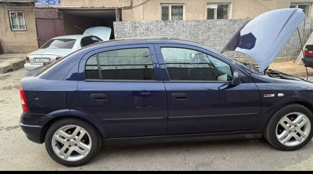 Опель астра машина