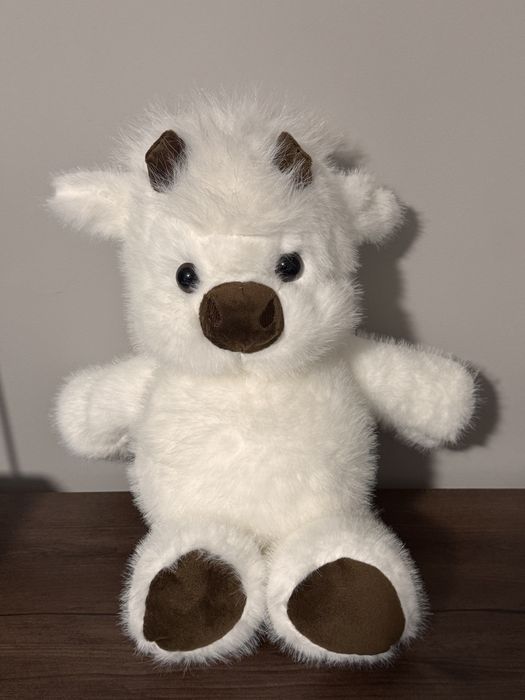 Игрушка бегущий теленок.