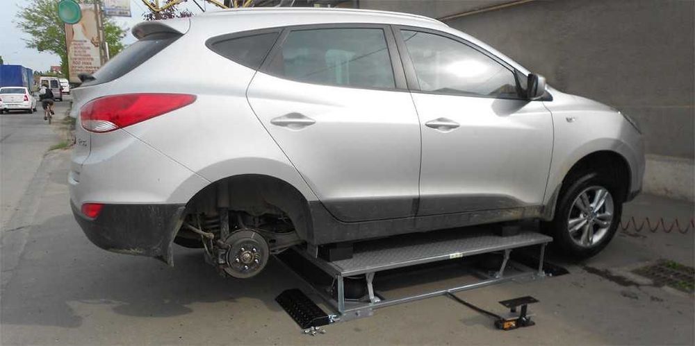 Elevator auto pe aer, compact, cu 4 perne  pentru vulcanizare
