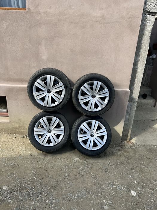 Set 4 jante tablă VW Golf 5 R16 + anvelope 205/55 R16 + 2 seturi capace VW