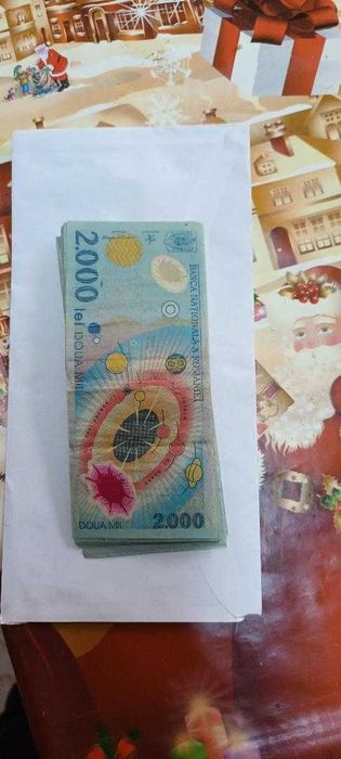 Vând bancnote de 2000 lei, cu eclipsa totală de soare din 1999.