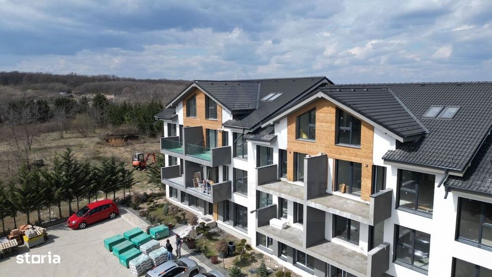 Apartament premium 61.4 mp utili 3 camere 2 bai curte 50 mp Cristian