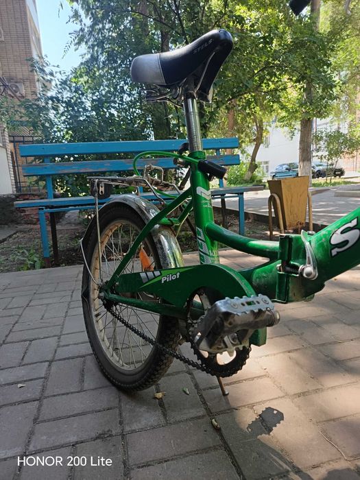 Велосипед STELS зеленого цвета
