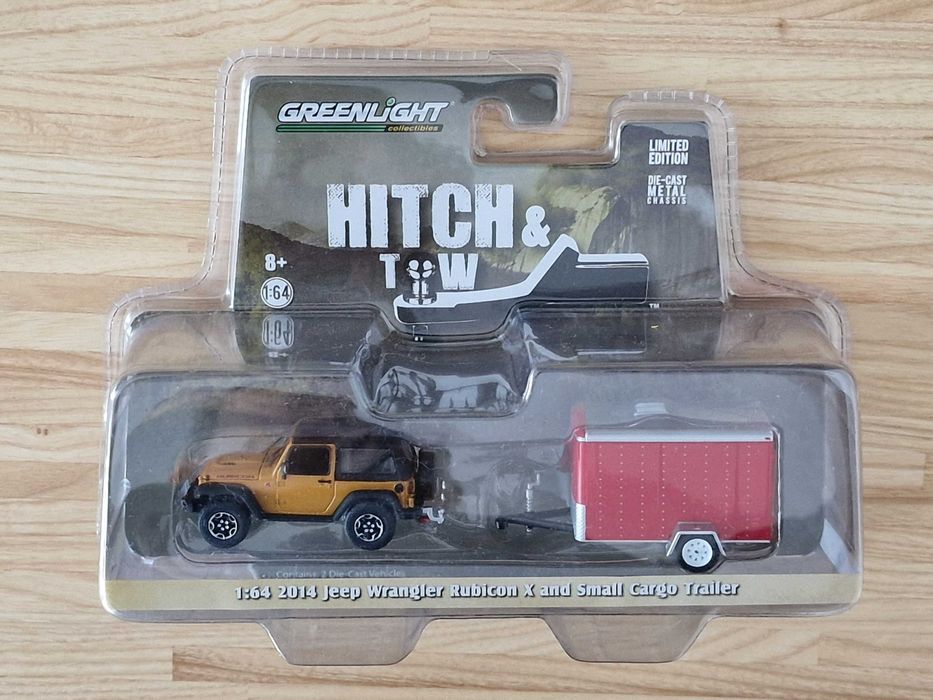 Macheta Jeep Wrangler Rubicon X 2014 cu trailer de bagaje 1:64 LE