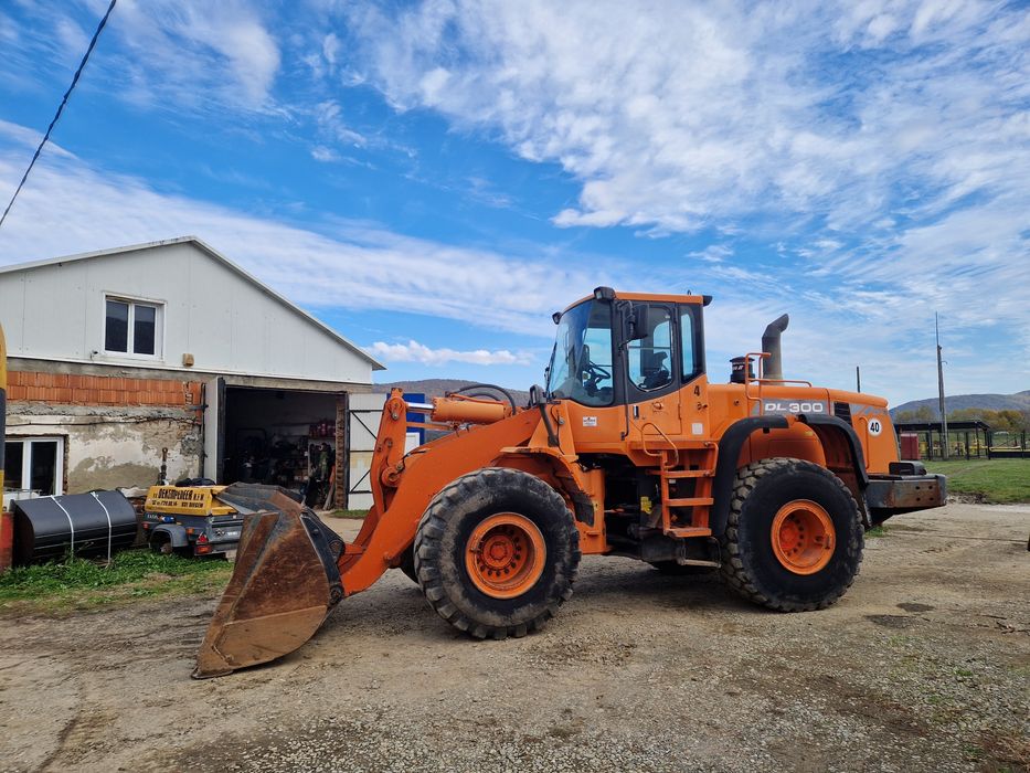 Încărcător frontal, Vola