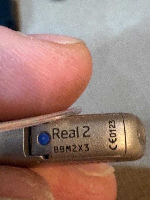 Aparat Auditiv Oticon Real 2 (Partea Stângă) – Tehnologie Premium, Reîncărcabil