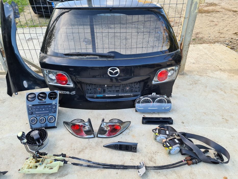Radio cd,stopuri,ceasuri bord,climatronic Mazda 6 combi