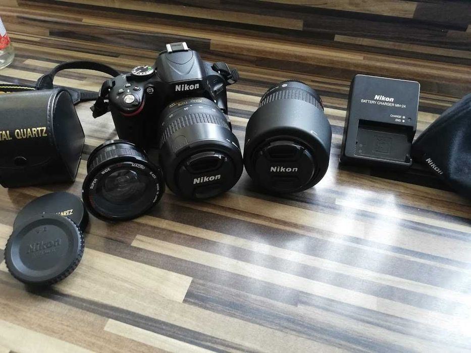 Продавам фотоапарат NIKON D5100 с пълен комплект обективи и аксесоари