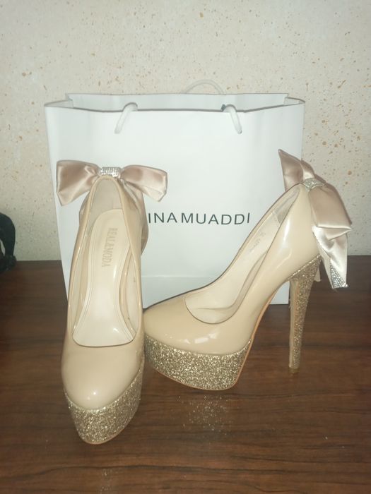 Vecherni tufli 35 razmer 1marta kiyilgan