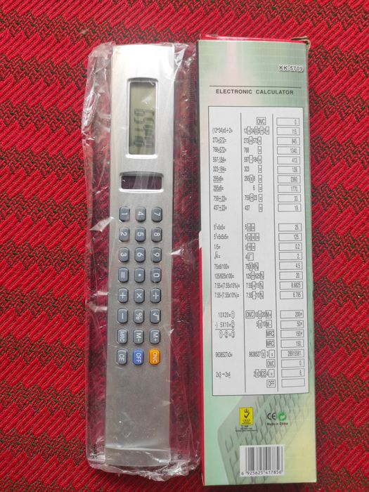 Calculator electronic cu fotocelulă și riglă în centimetri și inch