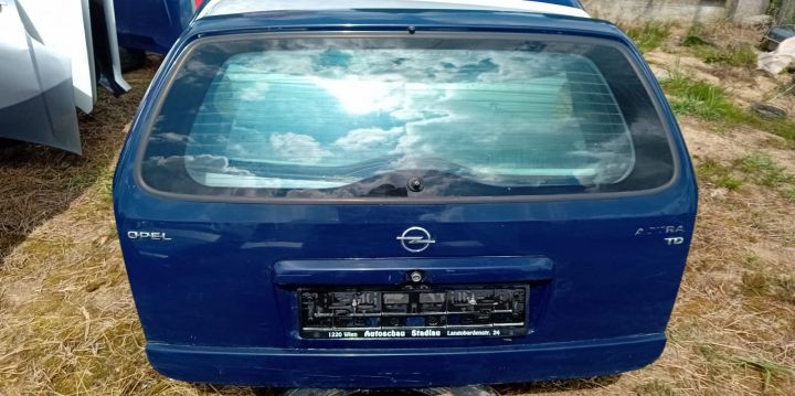 Haion  Mici zgarieturi cu luneta Opel Astra G