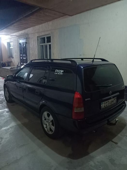 Машина Opel-Astra G