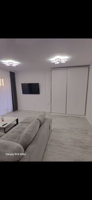 Tunari/Inchiriez Apartament cu grădină 2 camere 60mp  mobilat și utila