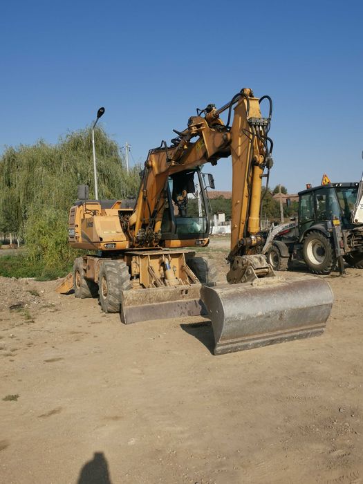 Excavator CASE pe roti, buldoexcavator si Bobcat Campia Turzii • OLX.ro