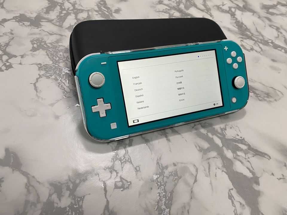 Nintendo Switch Lite in Turquoise and Accessories buy