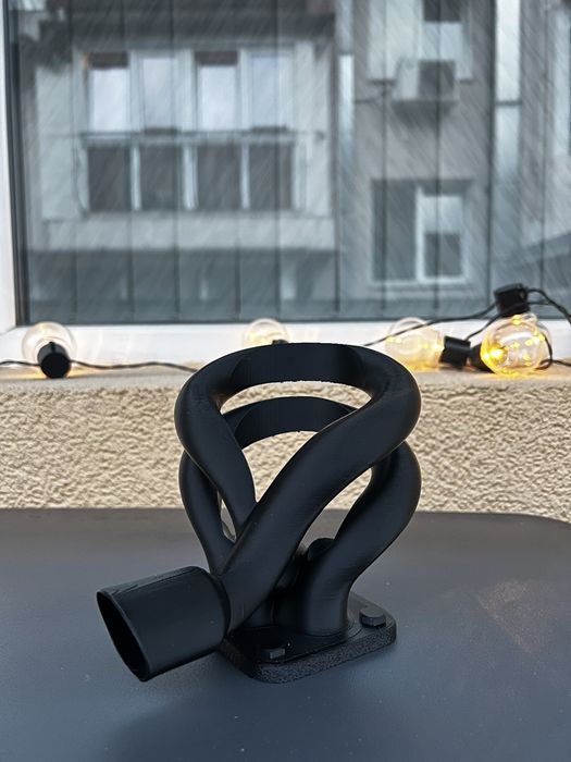 Поставка за кенче/чаша във формата на генерация